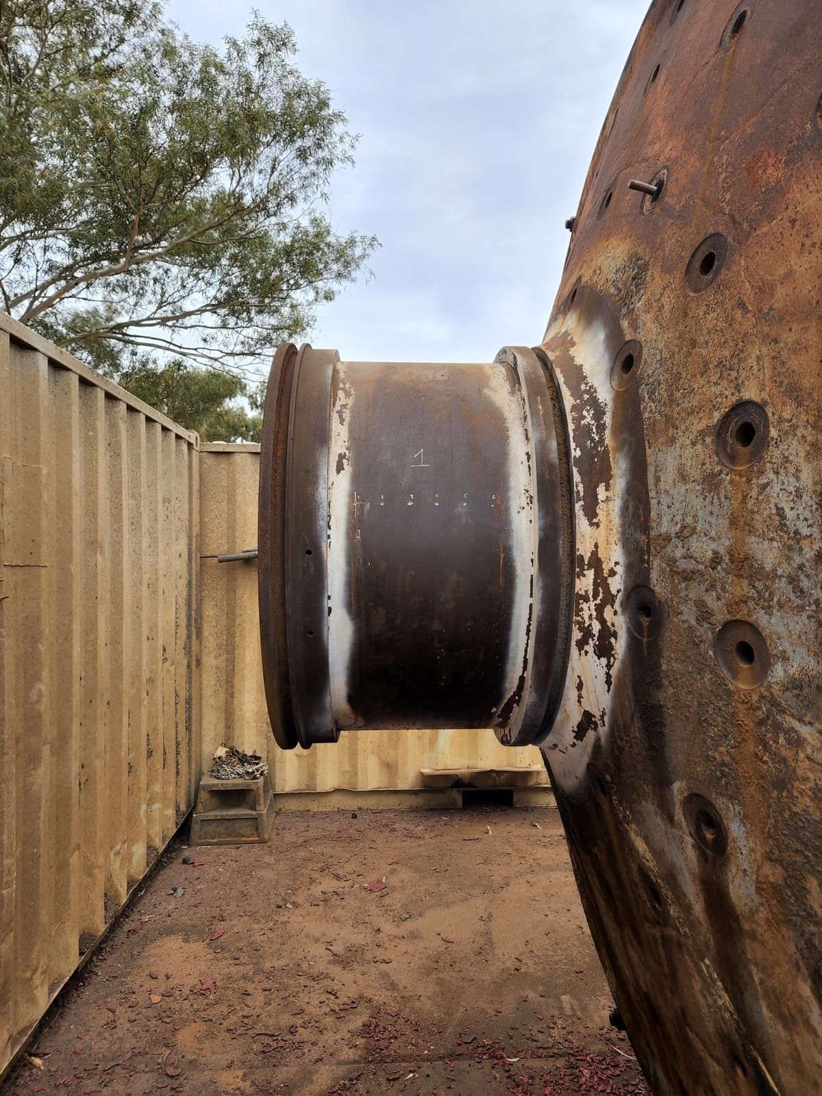 Industrial trunnion with heavy rust and scale before laser cleaning