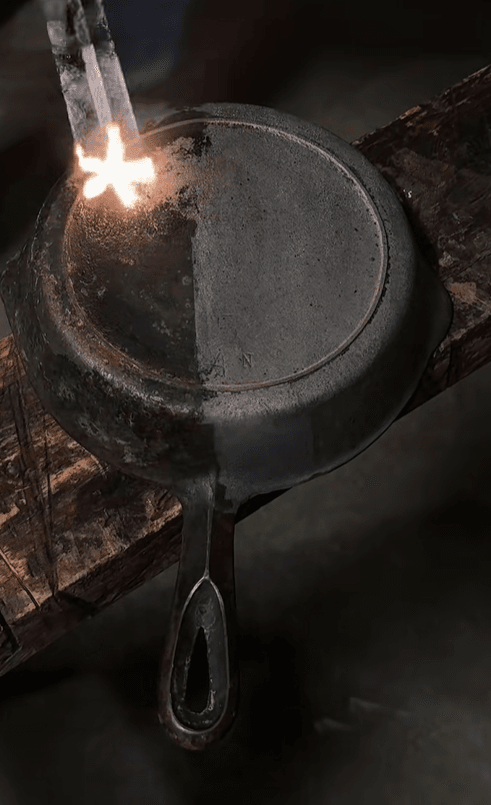 Cast iron piece during laser cleaning process